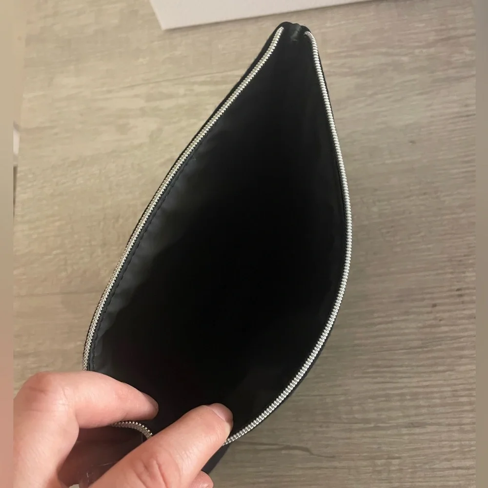 Authentic Dior flat pouch in Black. New. Comes with box.